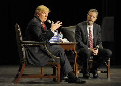 U.S. Republican presidential candidate Donald Trump and Jerry Falwell Jr. speak in the Orpheum Theatre during a campaign event in Sioux City, Iowa January 31 2016.
