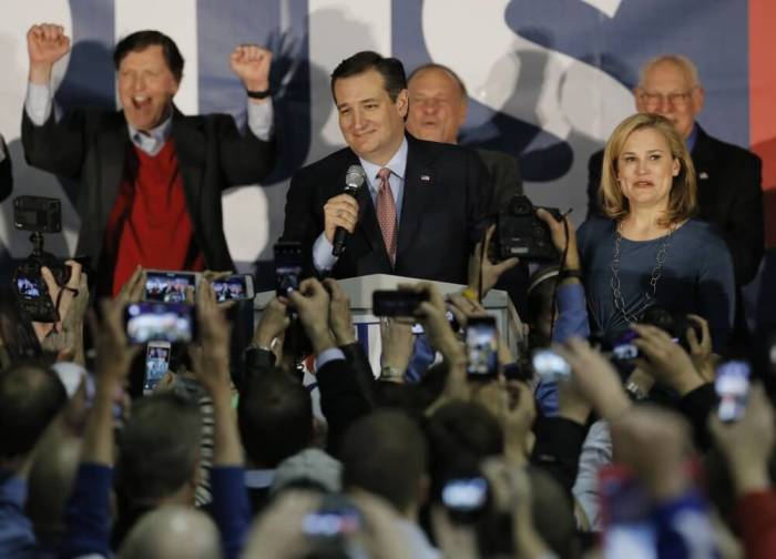 U.S. Republican presidential candidate Ted Cruz speaks, with his wife Heidi Cruz by his side, after winning at his Iowa caucus night rally in Des Moines, Iowa, United States, February 1, 2016.