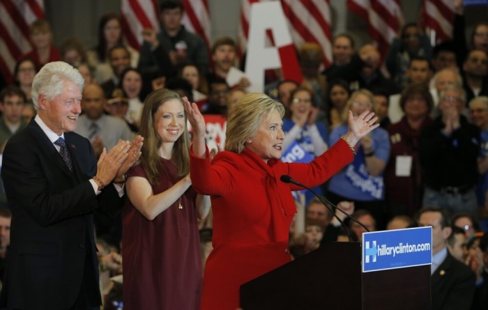 Democratic U.S. presidential candidate Hillary Clinton (R) celebrates with her husband, former President Bill Clinton (L) and her daughter Chelsea (2nd L), at her caucus night rally in Des Moines, Iowa February 1, 2016.