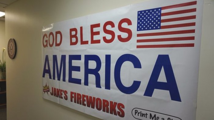 Jake's Fireworks post 'God bless America' sign after atheist group gets banner taken down from post office, Pittsburgh, Kansas, 2016.