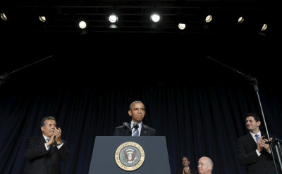 U.S. President Barack Obama receives applause as he takes to the lectern to speak at the National Prayer Breakfast in Washington February 4, 2016. At right is Speaker of the House Paul Ryan.