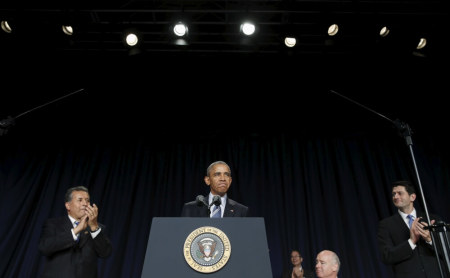 U.S. President Barack Obama receives applause as he takes to the lectern to speak at the National Prayer Breakfast in Washington February 4, 2016. At right is Speaker of the House Paul Ryan.