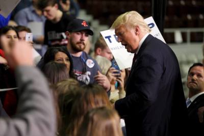 U.S. Republican presidential candidate Donald Trump greets supporters at a campaign rally in Little Rock, Arkansas February 3, 2016.