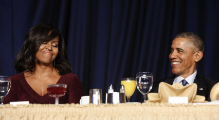 U.S. President Barack Obama and First lady Michelle Obama smile as they attend the National Prayer Breakfast in Washington February 4, 2016.
