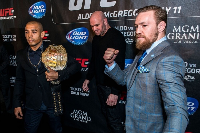 Conor McGregor (R) and José Aldo (L) pose for photos during the UFC 189 press conference in London, March 2015. Aldo ended up pulling out of the bout 11 days before UFC 189 due to rib injury.