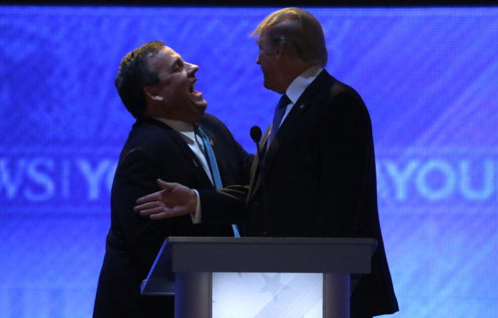 Republican U.S. presidential candidate Governor Chris Christie (L) and rival candidate Donald Trump (R) laugh together during a commercial break in the midst of the Republican U.S. presidential candidates debate sponsored by ABC News at Saint Anselm College in Manchester, New Hampshire February 6, 2016.