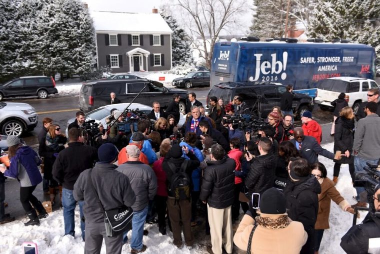 U.S. Republican presidential candidate, Governor Jeb Bush is swarmed by the media as he arrives to greet supporters at the Manchester precinct, Webster Elementary School in Manchester, New Hampshire February 9, 2016.