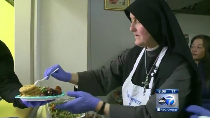 A group of Chicago nuns facing eviction from the building where they run a soup kitchen in San Francisco, California, seen distributing food to the homeless in a WLS-TV report in Chicago, Illinois, on February 9, 2016.