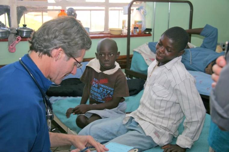 The Rev. Dr. Paul Osteen treats children during a medical mission in far western Zambia where he visited Mukinge and Chitokoloki Hospitals.