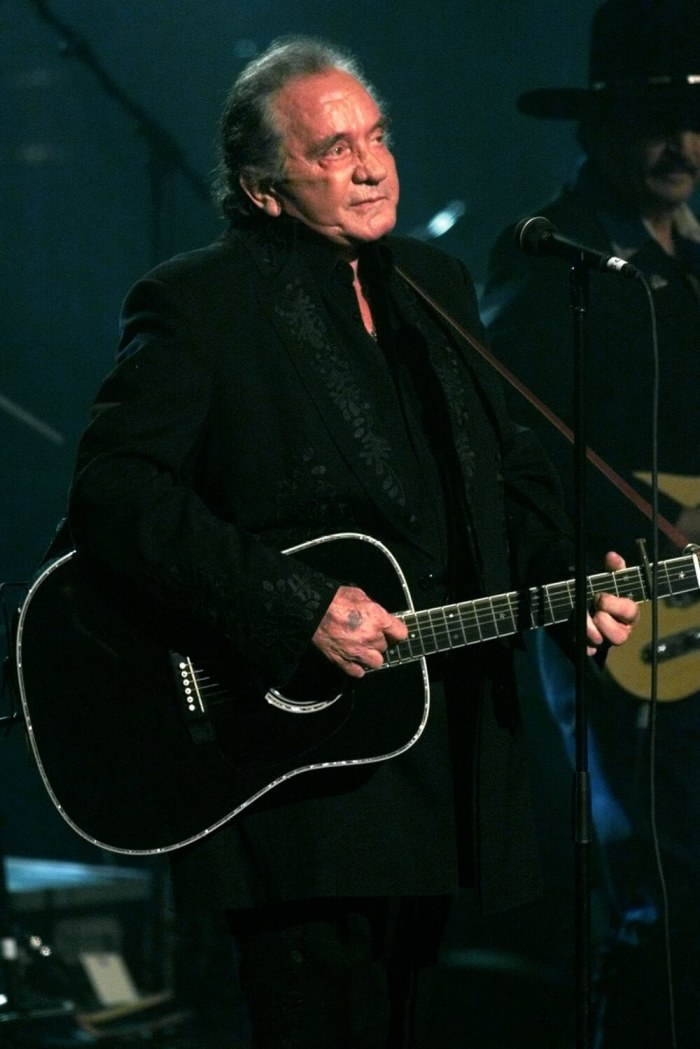Legendary singer Johnny Cash performs a song at the end of a tribute in his honor in New York, April 6. Cash's career spans over 40 years. The tribute was filmed for a TNT masters series concert show that will be shown on the cable TV network.