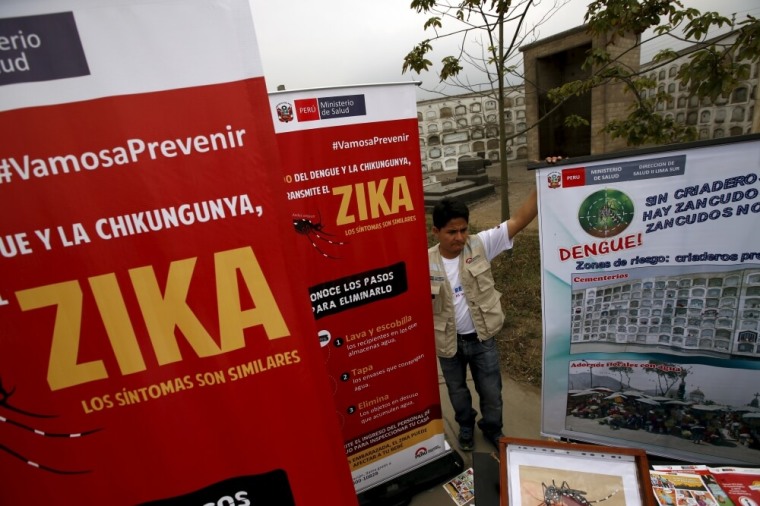 A health worker gives information during a preventive campaign against the Zika virus and other mosquito-borne diseases, at the cemetery of Presbitero Maestro in Lima, Peru, February 12, 2016.