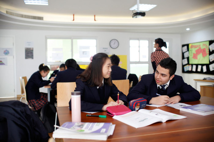 Students attend a class at the Oxford International College in Changzhou, Jiangsu province January 10, 2013. The website for a private school in Changzhou, one of China's smaller cities, features blue blazers and plaid skirts, music classes and an ivy-clad brick doorway -- all the trappings of the British school system designed to appeal to wealthy Chinese parents. In choosing a smaller city, Oxford International College - no relation to the British university - is tapping into a growing market of upwardly-mobile Chinese willing to pay as much as 260,000 yuan (,700) a year for a Western-style education and a ticket to college overseas. Picture taken January 10, 2013.