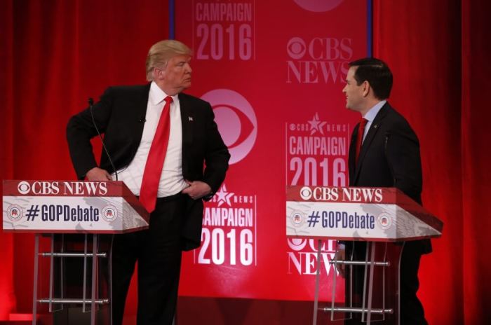 Republican U.S. presidential candidate Donald Trump (L) speaks with Senator Marco Rubio during a commercial break at the Republican U.S. presidential candidates debate sponsored by CBS News and the Republican National Committee in Greenville, South Carolina February 13, 2016.