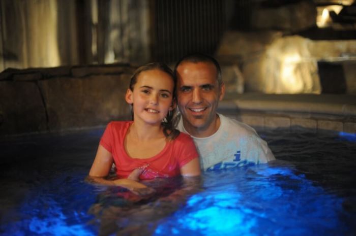Jessie Rees poses with her father, Erik, after he baptized her at Saddleback Church.