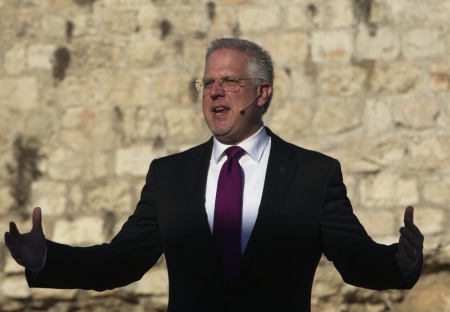 U.S. conservative broadcaster Glenn Beck gestures as he addresses the crowd during his 