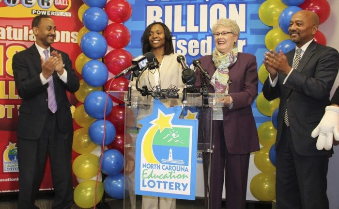 Powerball winner Marie Holmes, second from left, of Shallotte, N.C., announces in February 2015, that she won a third of a 4 million jackpot at a news conference with financial adviser Dexter Perry, North Carolina Education Lottery executive director Alice Garland, second from right, and attorney Charles Francis in Raleigh, N.C.