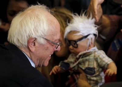 U.S. Democratic presidential candidate Bernie Sanders greets Oliver Lomas, who is dressed up as Sanders, at a campaign rally in Las Vegas, Nevada, United States, February 14, 2016.