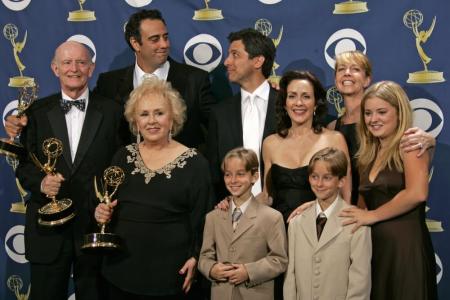 The Emmy-winning cast of "Everyone Loves Raymond" poses backstage at the 57th annual Prime Time Emmy Awards in Los Angeles, September 18, 2005. "Everybody Loves Raymond," which recently ended its nine-year CBS run, clinched an upset victory as best comedy at the Emmy Awards.
