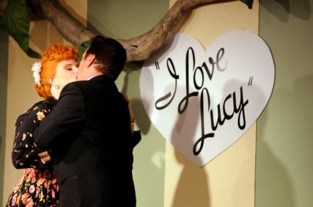 Professional impersonators portraying Lucy Ricardo (L) and Ricky Ricardo perform in a replica of the 