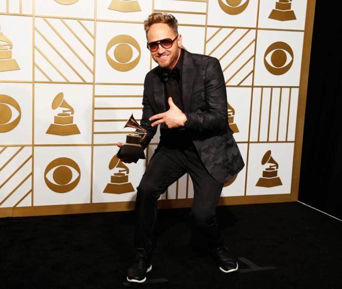 Tobymac holds the award for Best Contemporary Christian Music Album for 'This Is Not A Test' during the 58th Grammy Awards in Los Angeles, California February 15, 2016.