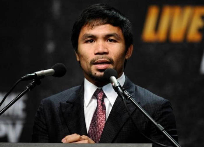 Manny Pacquiao speaks during a press conference to announce his fight with Floyd Mayweather.