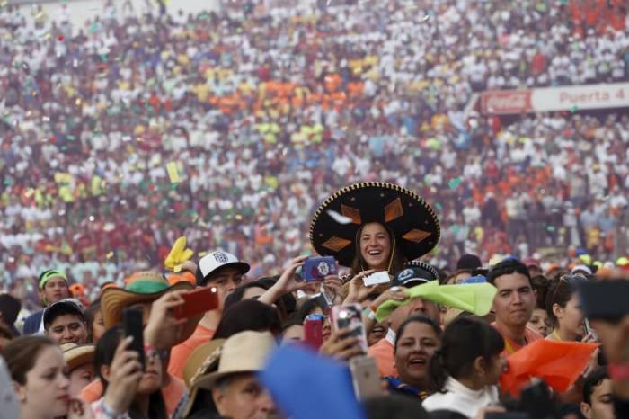 Youths cheer during a meeting with Pope Francis (not pictured) at the Jose Maria Morelos y Pavon stadium in Morelia, Mexico, February 16, 2016.