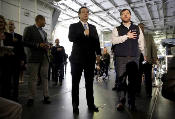 U.S. Republican presidential candidate Senator Ted Cruz (R-TX) recites the Pledge of Allegiance at a campaign event on the USS Yorktown in Mount Pleasant, South Carolina February 16, 2016.