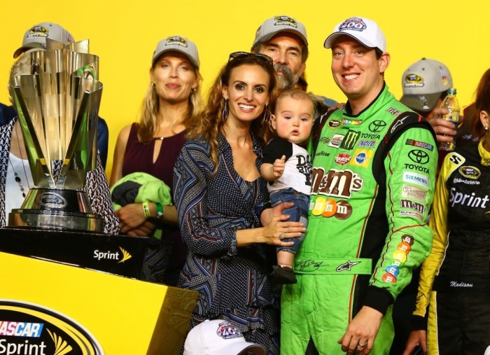 NASCAR Sprint Cup Series driver Kyle Busch poses with wife Samantha Busch and son Brexton Busch after winning the Ford EcoBoost 400 at Homestead-Miami Speedway, Homestead, Florida, November 22, 2015.