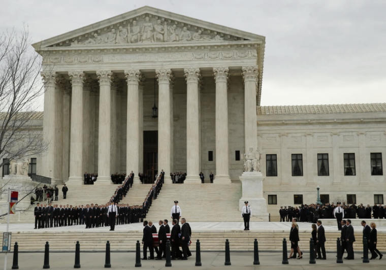 The casket of late U.S. Supreme Court Justice Antonin Scalia arrives at the Supreme Court, where Scalia's body is lying in repose in the court's Great Hall in Washington February 19, 2016. Scalia died on February 13, 2016 at the age of 79.