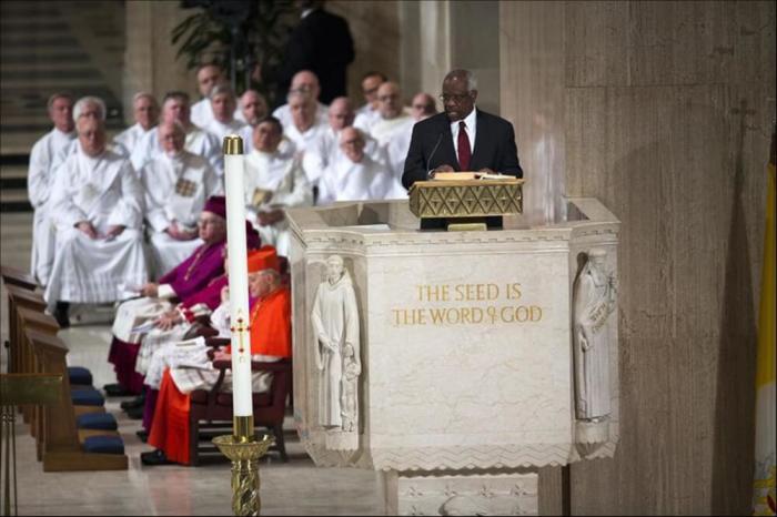 U.S. Supreme Court Justice Clarence Thomas delivers a reading from the Bible during the funeral Mass for Associate Justice Antonin Scalia at the Basilica of the National Shrine of the Immaculate Conception in Washington, February 20, 2016.