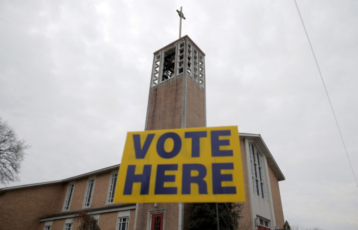 A 'vote here' sign stands in front of the polling place at the Reformation Lutheran Church in Columbia, South Carolina February 20, 2016.