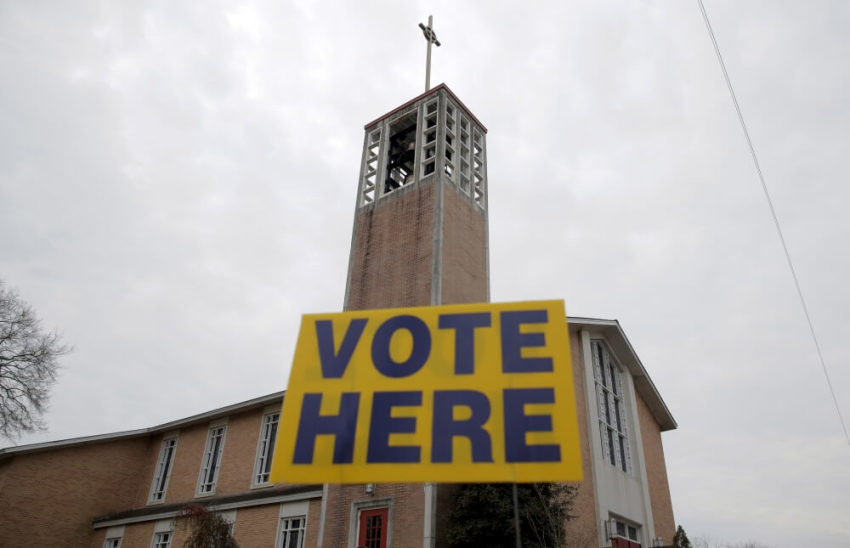 A "vote here" sign stands in front of the polling place at the Reformation Lutheran Church in Columbia, South Carolina February 20, 2016.
