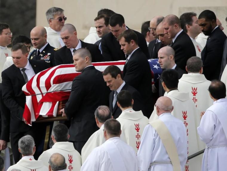 Pallbearers carry the casket of U.S. Supreme Court Associate Justice Antonin Scalia out of his funeral mass at the Basilica of the National Shrine of the Immaculate Conception in Washington, February 20, 2016.