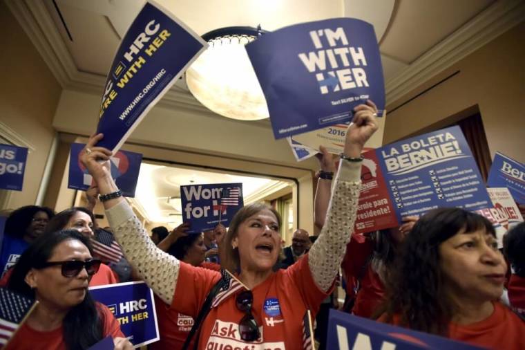 Supporters cheer for their respective Democratic candidate outside a caucus location at Caesars Palace in Las Vegas, Nevada, February 20, 2016.