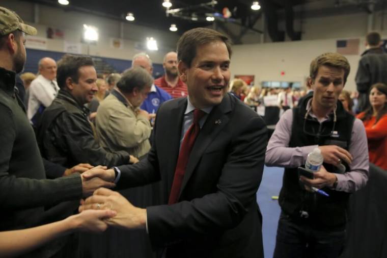 U.S. Republican presidential candidate Marco Rubio shakes hands with supporters as he leaves after a campaign event in North Charleston, South Carolina February 19, 2016.