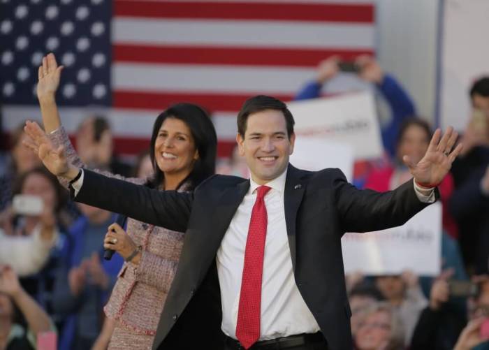 South Carolina Governor Nikki Haley (L) and U.S. Republican presidential candidate Marco Rubio react on stage during a campaign event in Chapin, South Carolina, February 17, 2016. Haley announced her endorsement of Rubio for the Republican presidential nomination.
