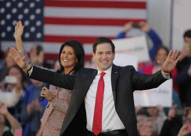 South Carolina Governor Nikki Haley (L) and U.S. Republican presidential candidate Marco Rubio react on stage during a campaign event in Chapin, South Carolina, February 17, 2016. Haley announced her endorsement of Rubio for the Republican presidential nomination.