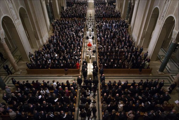 Pallbearers carry the casket down the aisle at the start of the funeral Mass for Associate Justice Antonin Scalia at the Basilica of the National Shrine of the Immaculate Conception in Washington, February 20, 2016.