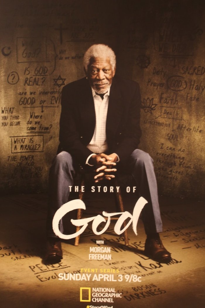 A poster for the NatGeo docu-series 'The Story of God,' hosted by Academy Award-winning actor Morgan Freeman, sits outside a screening event at National Geographic headquarters in Washington, DC on February 3, 2016.