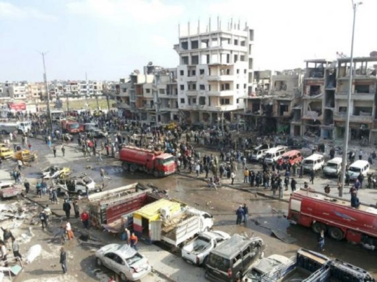 A general view shows the site of a two bomb blasts in the government-controlled city of Homs, Syria, in this handout picture provided by SANA on February 21, 2016.