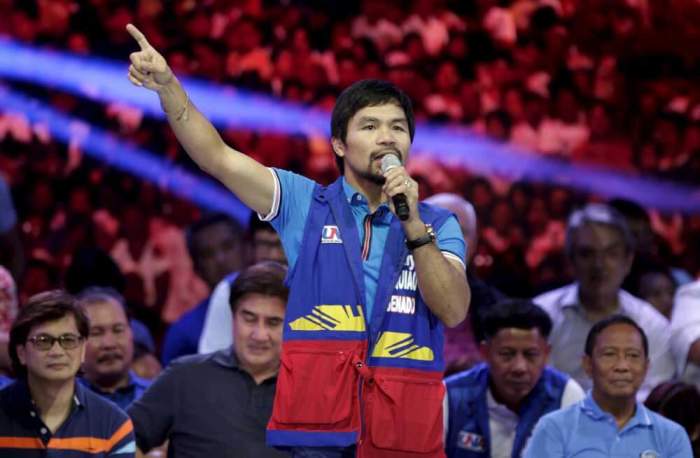 Filipino boxer Manny Pacquiao, who is running for Senator in the May 2016 national elections, speaks to supporters during the start of elections campaigning in Mandaluyong city, Metro Manila February 9, 2016.