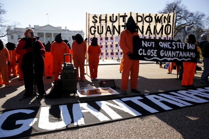 Protesters in orange jumpsuits from Amnesty International USA and other organizations rally outside the White House to demand the closure of the U.S. prison at Guantanamo Bay, in Washington January 11, 2016.