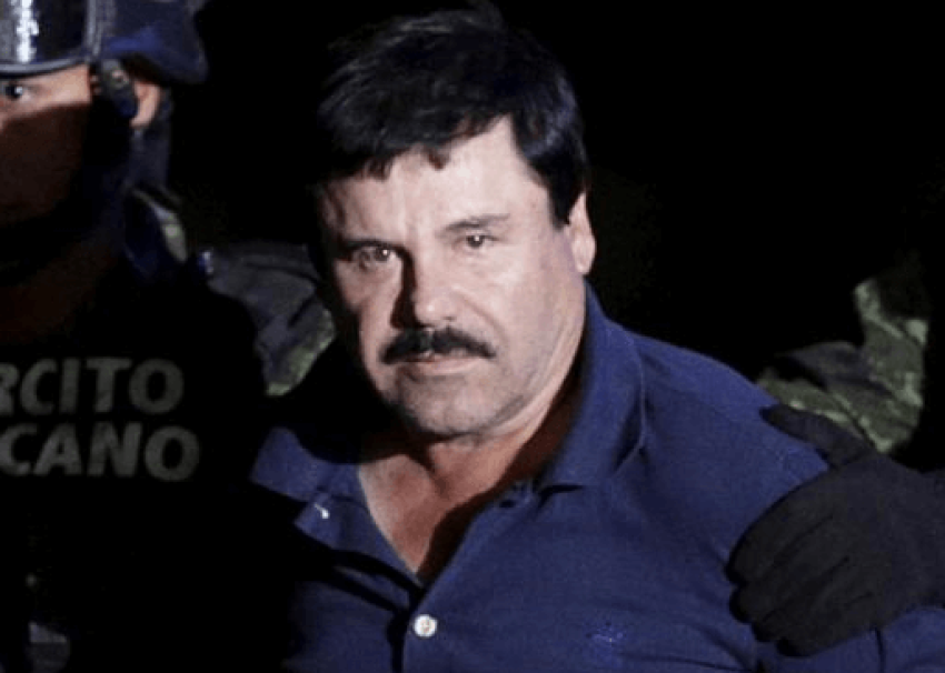 Recaptured drug lord Joaquin "El Chapo" Guzman is escorted by soldiers