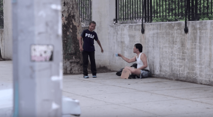 Kid offers dollar bill to homeless man instead of getting ice cream.
