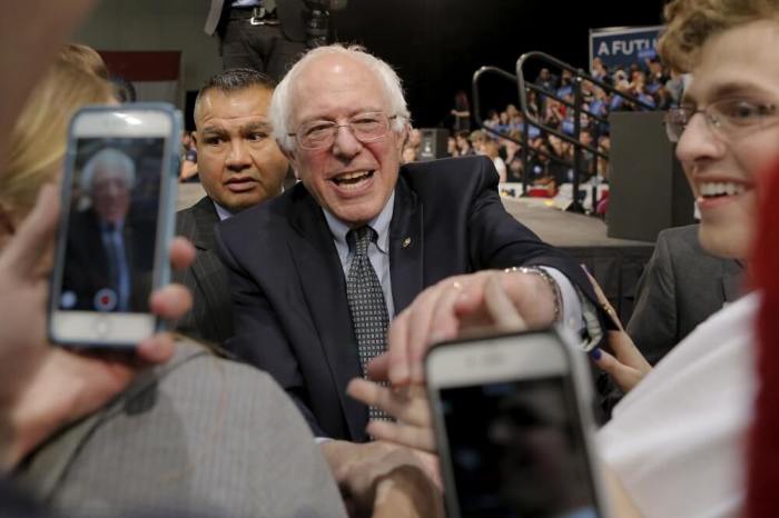 U.S. Democratic presidential candidate and U.S. Senator Bernie Sanders greets audience members at a campaign rally in Kansas City, Missouri February 24, 2016.