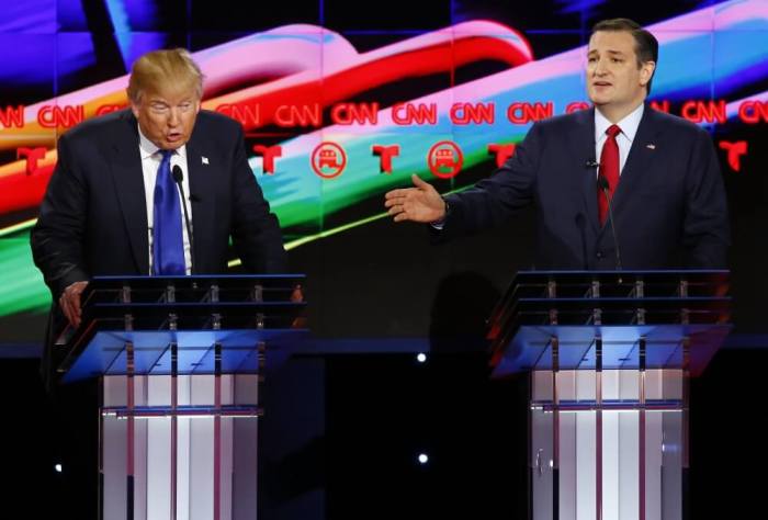 Republican U.S. presidential candidates Donald Trump (L) and Ted Cruz speak simultaneously as they discuss an issue during the debate sponsored by CNN for the 2016 Republican U.S. presidential candidates in Houston, Texas, February 25, 2016.