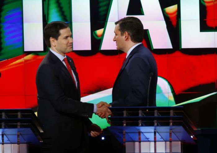 Republican U.S. presidential candidates Marco Rubio (L) and Ted Cruz shake hands at the conclusion of the debate sponsored by CNN for the 2016 Republican U.S. presidential candidates in Houston, Texas, February 25, 2016.