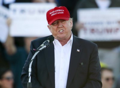 U.S. Republican presidential candidate Donald Trump speaks to supporters at a rally at Madison City Schools Stadium in Madison, Alabama February 28, 2016.