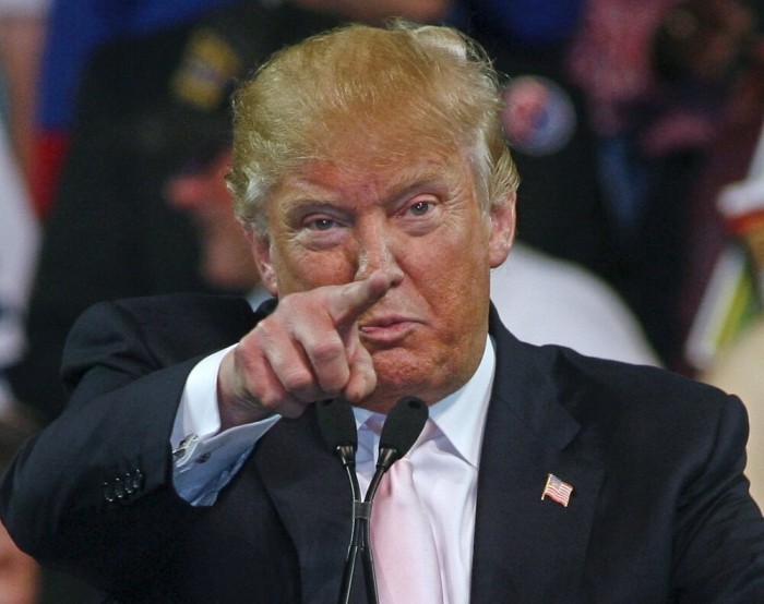 Republican U.S. presidential candidate Donald Trump gestures at a campaign rally at Valdosta State University in Valdosta, Georgia February 29, 2016.