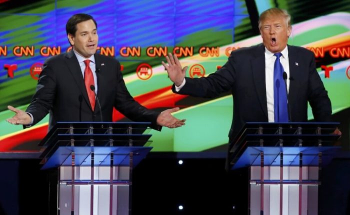 Marco Rubio and Donald Trump speak simultaneously during a Republican U.S. presidential debate in Houston, Texas, February 25, 2016.